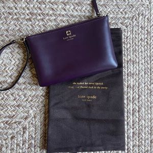 Purple Kate spade wristlet with dust bag